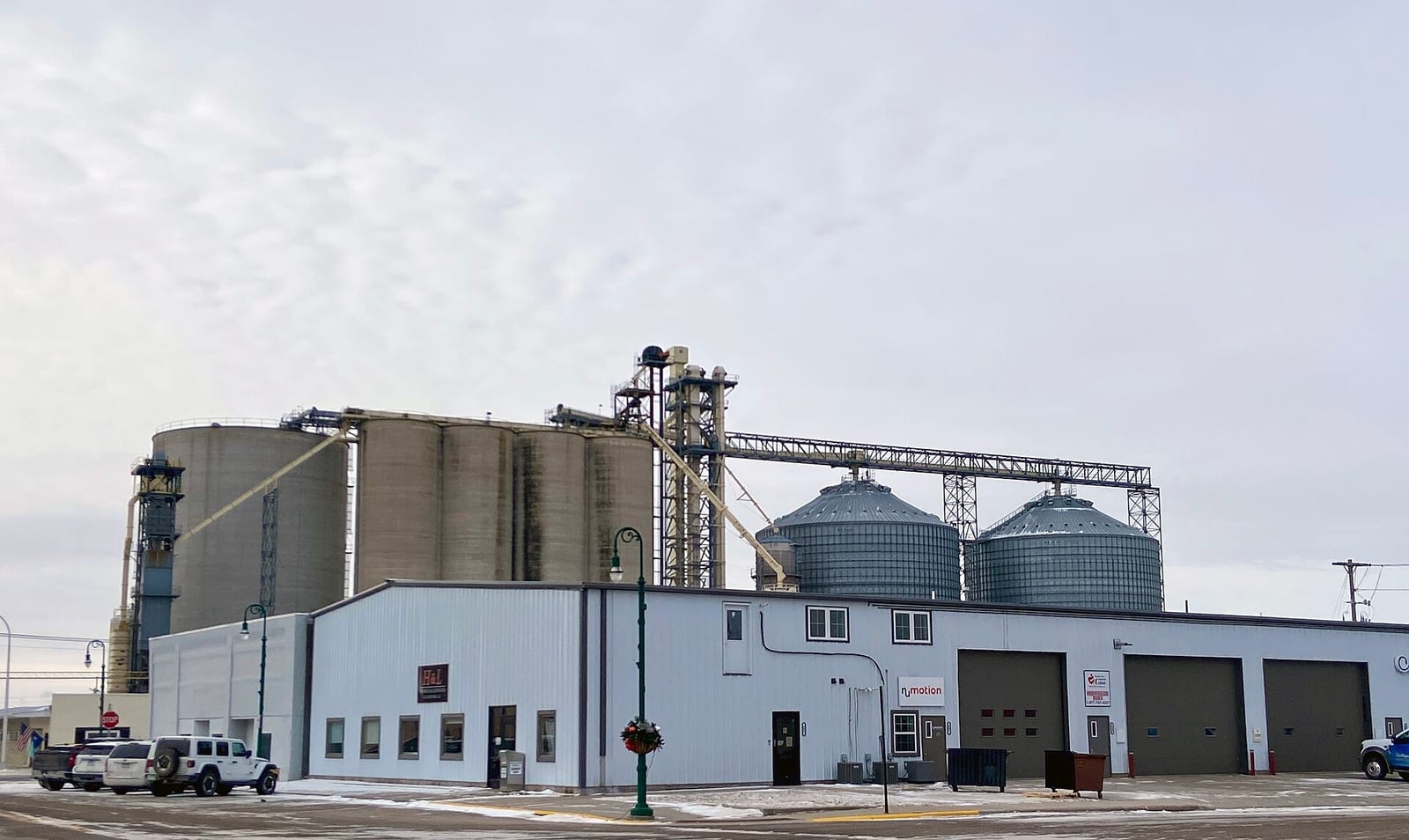 A commercial grain elevator with multiple large storage silos
